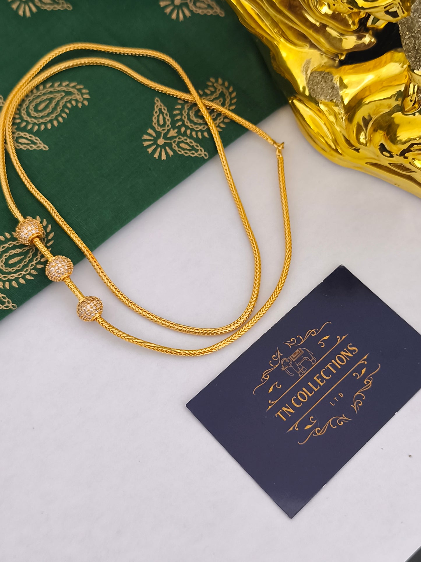 Micro gold mugappu Kodi