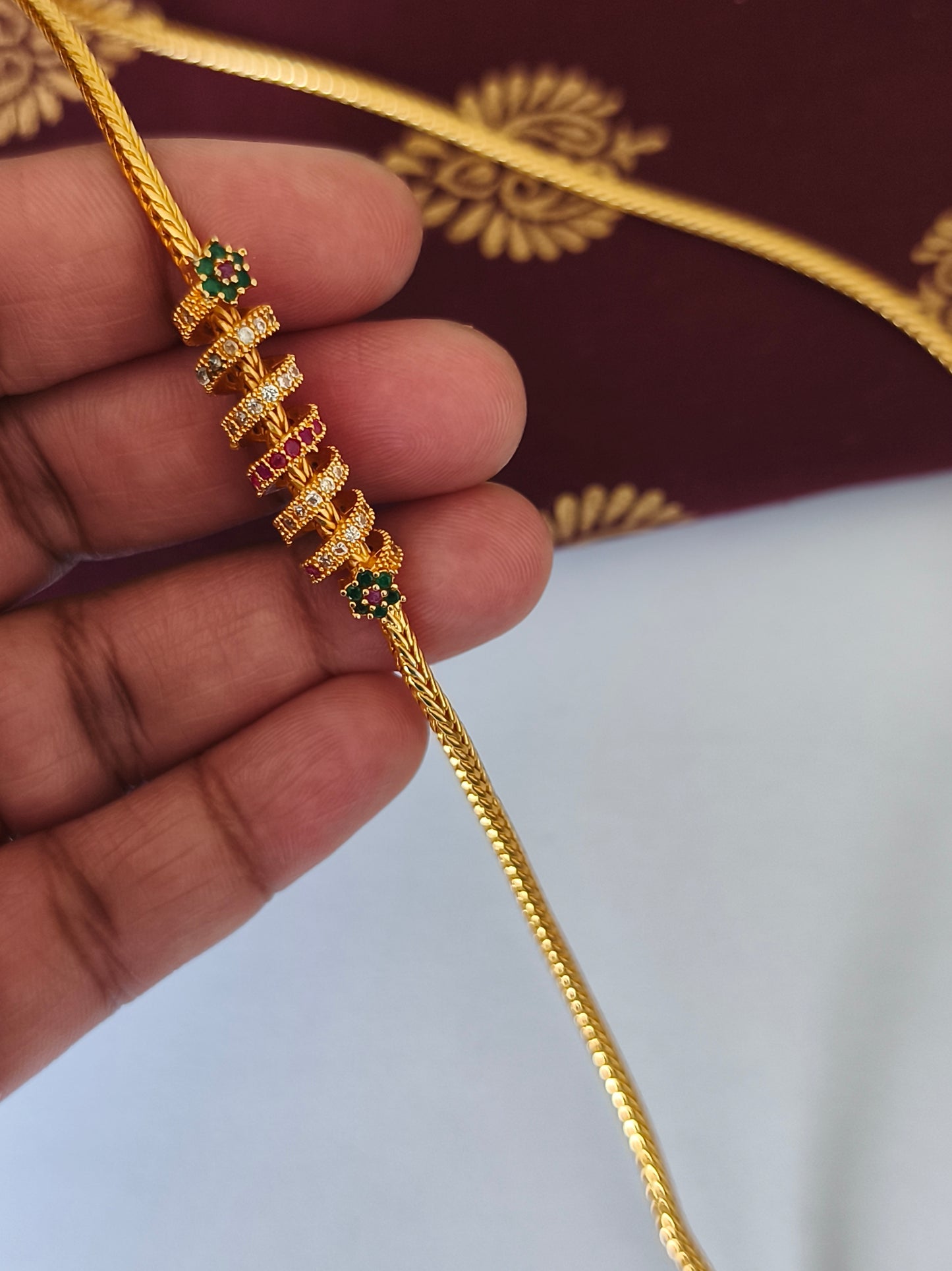 Micro gold plated Traditional Mugappu Kodi (White, Ruby & Green stone)