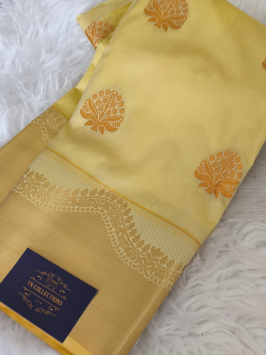 Yellow Kanchi embossed soft silk saree
