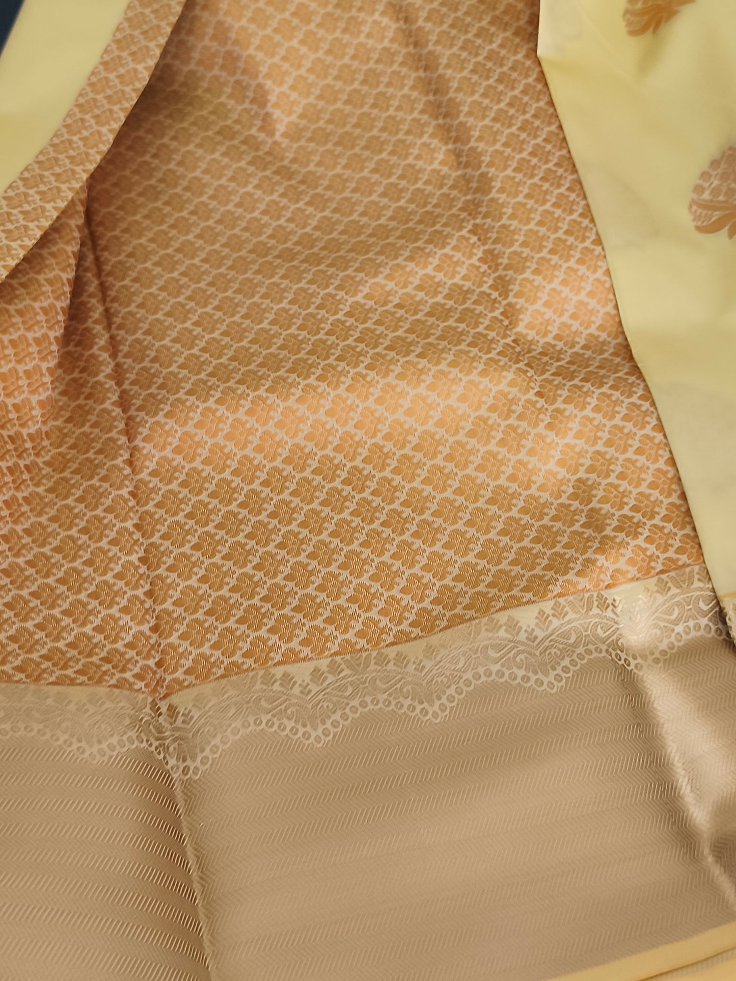 Yellow Kanchi embossed soft silk saree