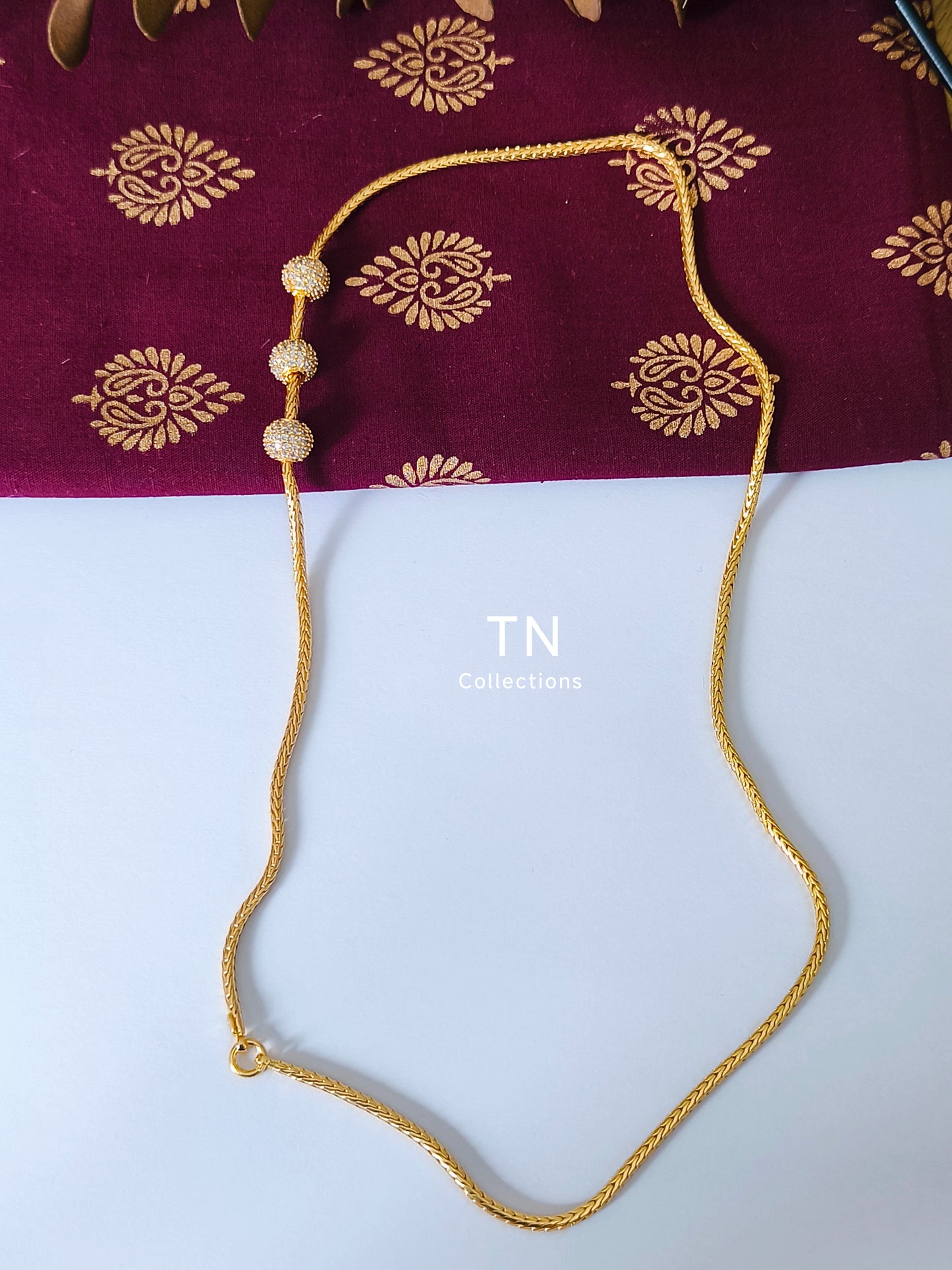 Gold plated Traditional Mugappu Kodi (white stone)
