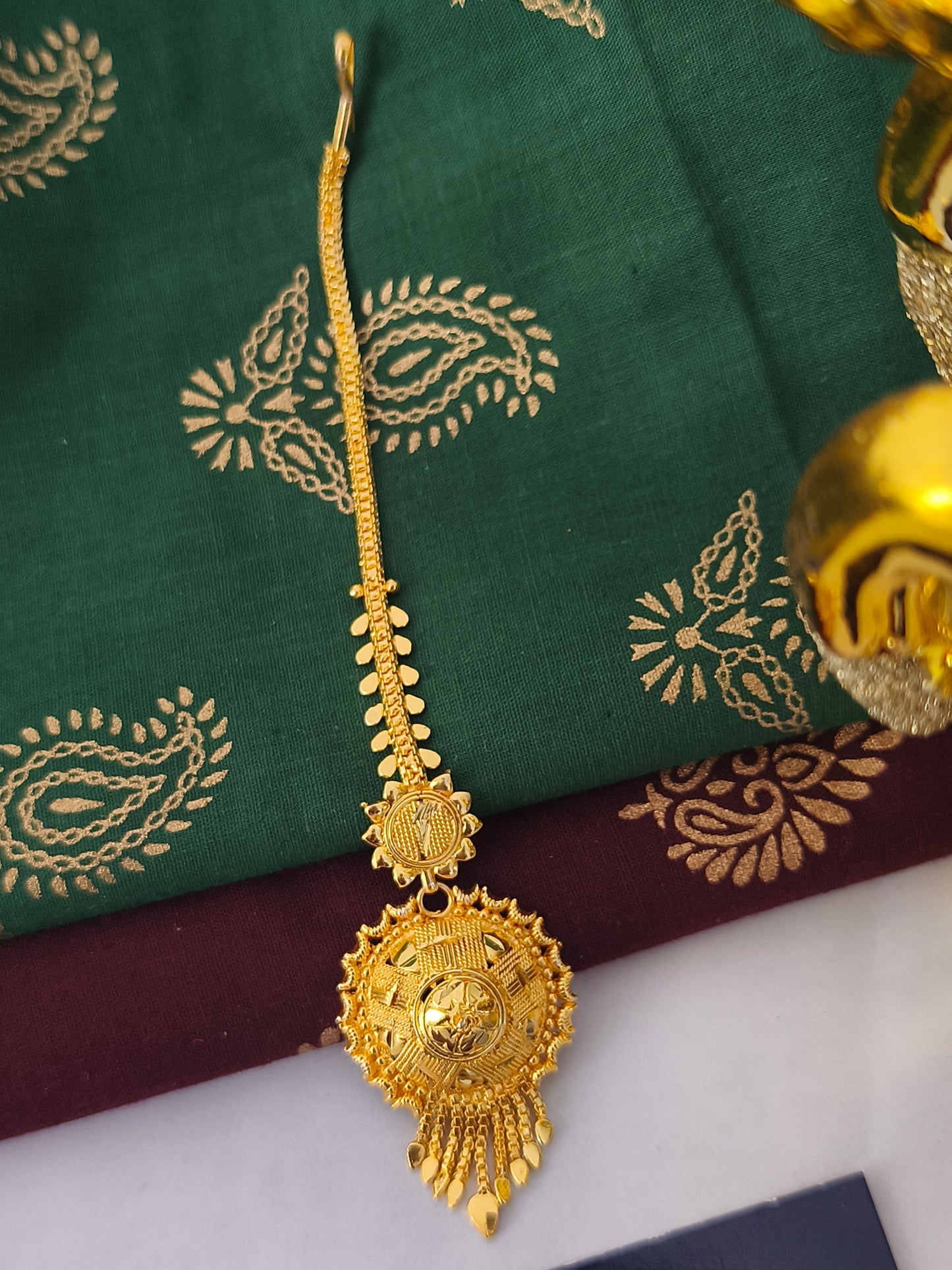 One gram gold forming Tikka