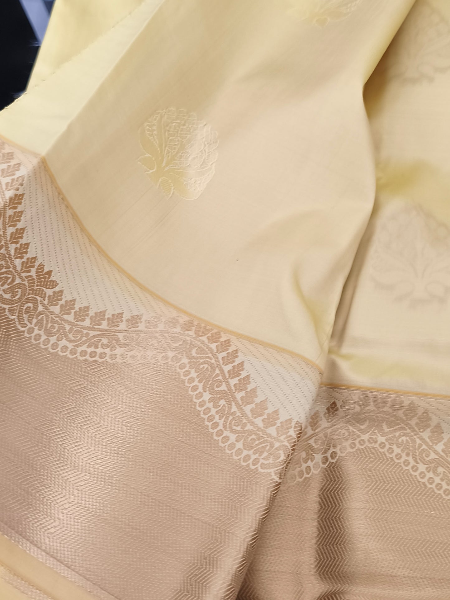 Yellow Kanchi embossed soft silk saree