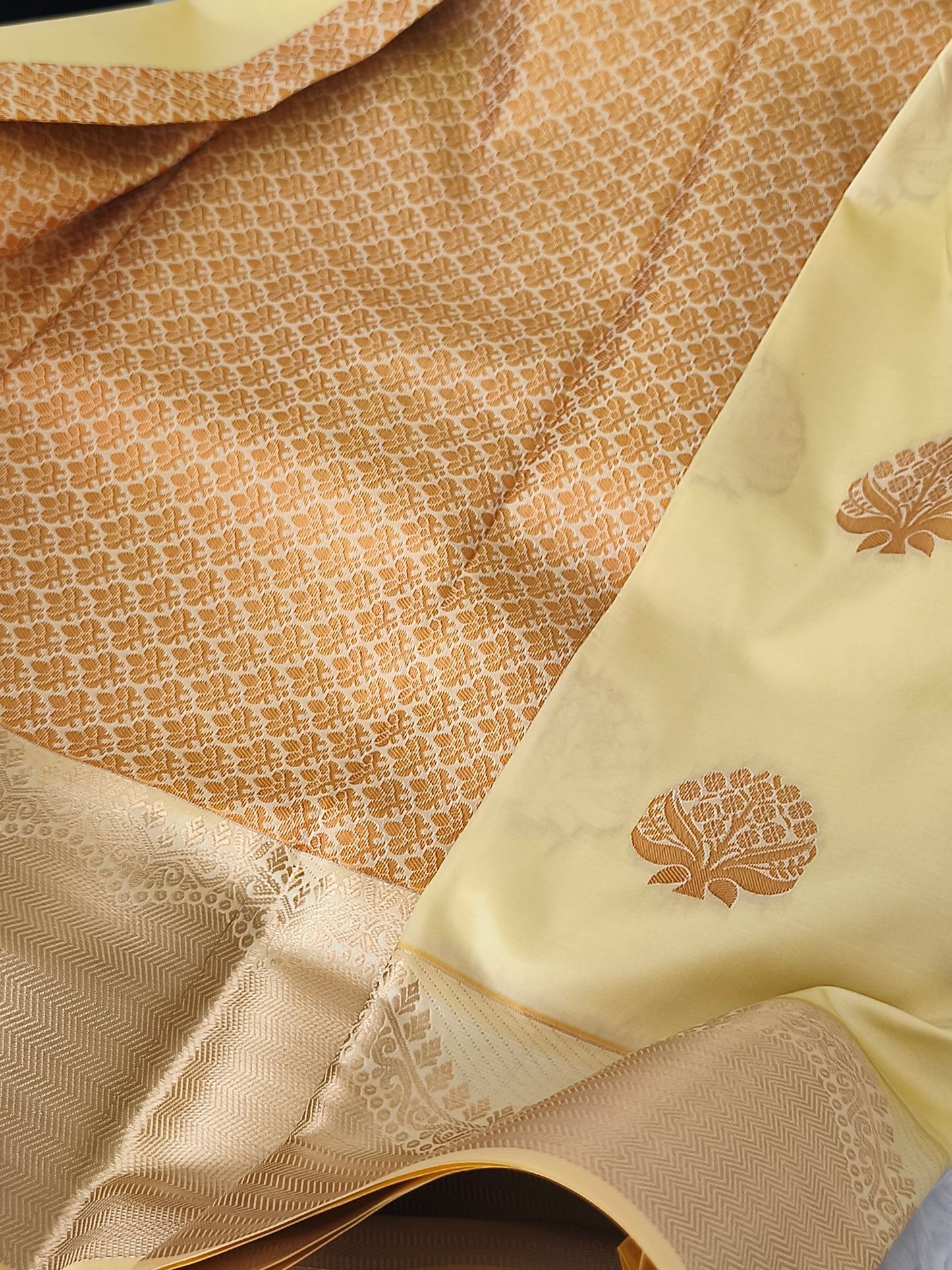 Yellow Kanchi embossed soft silk saree