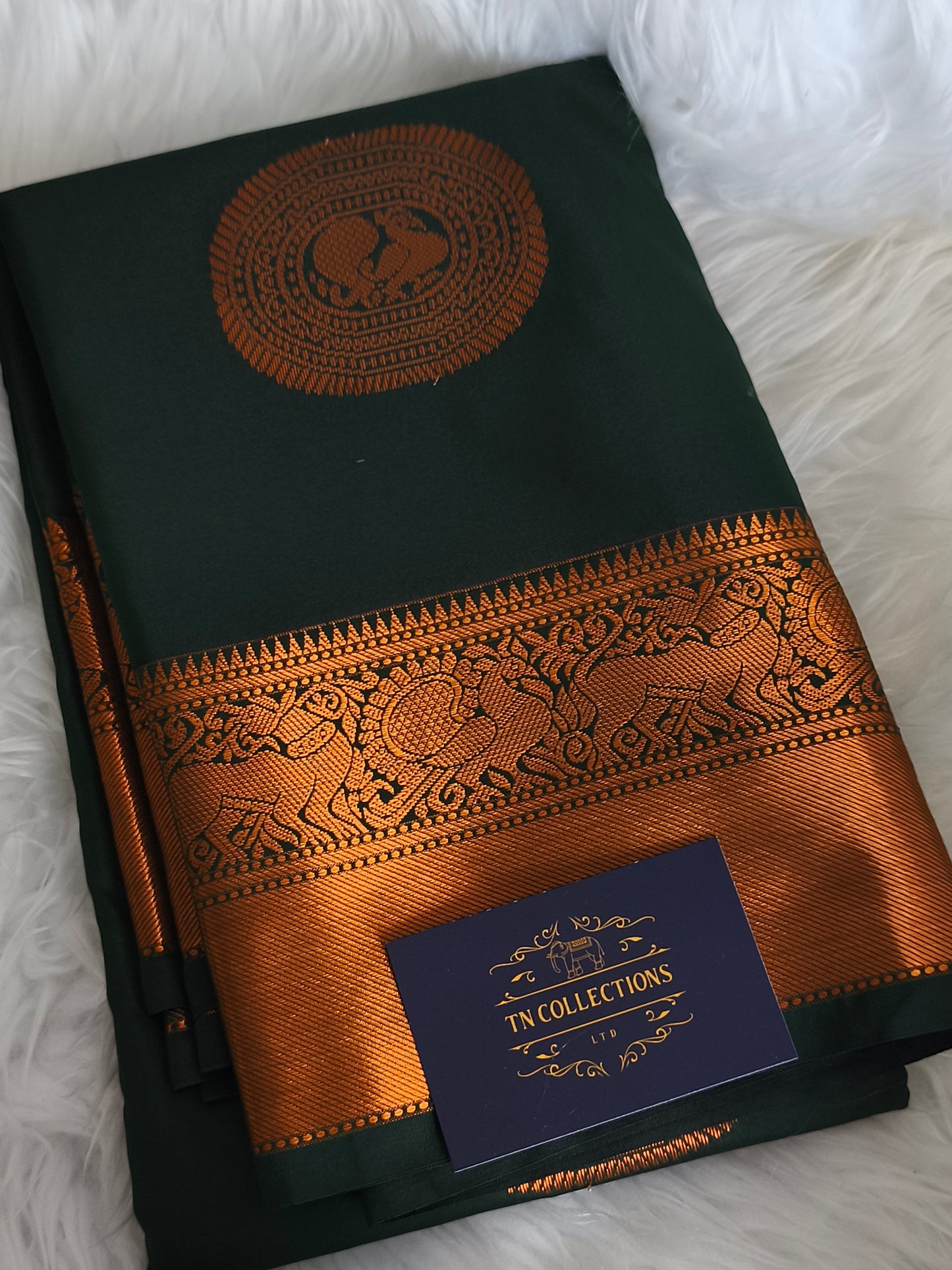 Dark Green Traditional Kanchi embossed Soft Silk saree