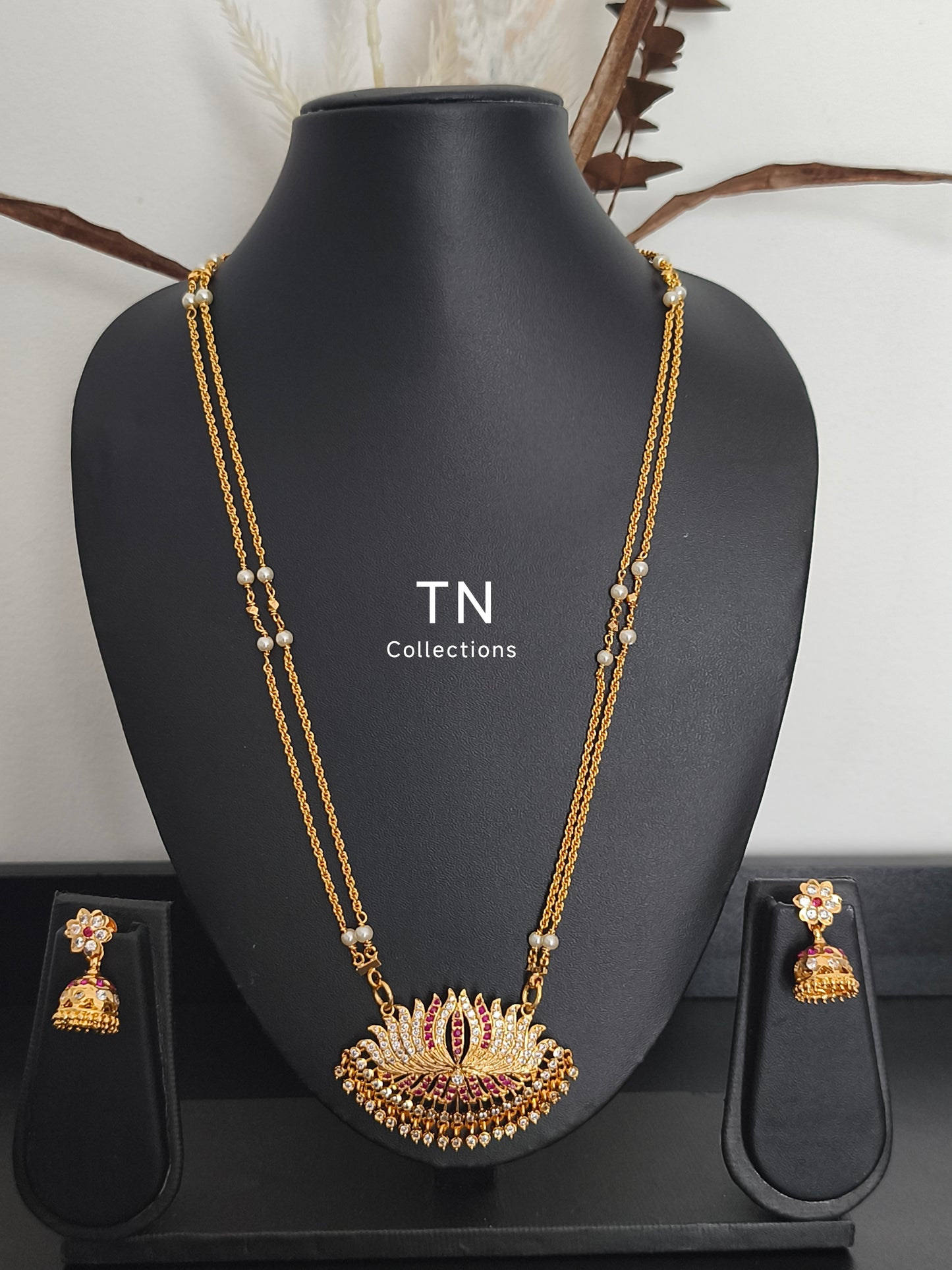Impon Lotus Pathakkam with earrings