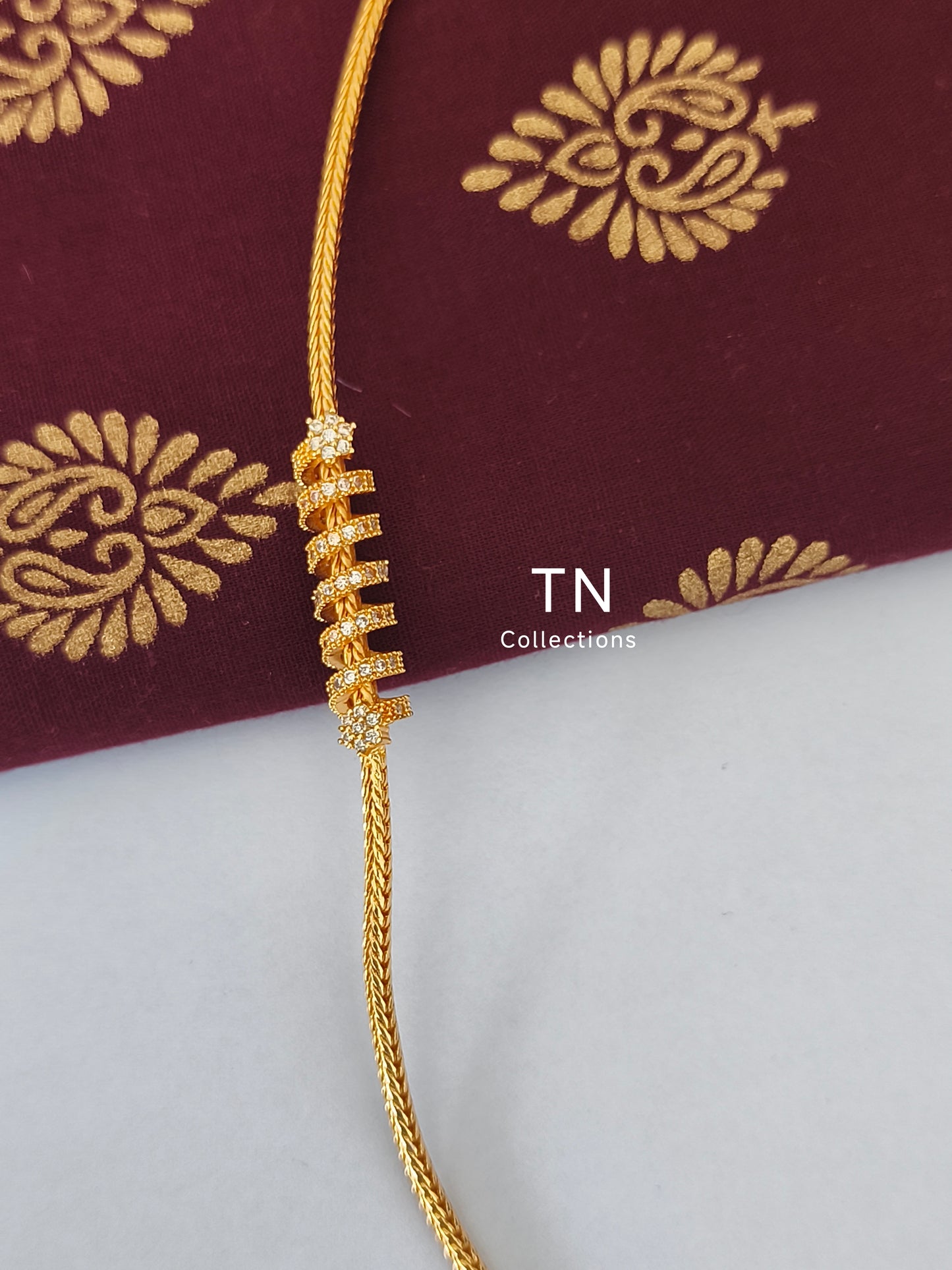 Micro gold plated Traditional Mugappu Kodi (White stone)