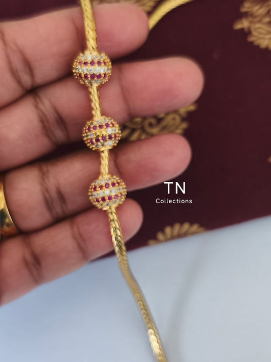 Gold plated Traditional Mugappu Kodi (Ruby & White stones)