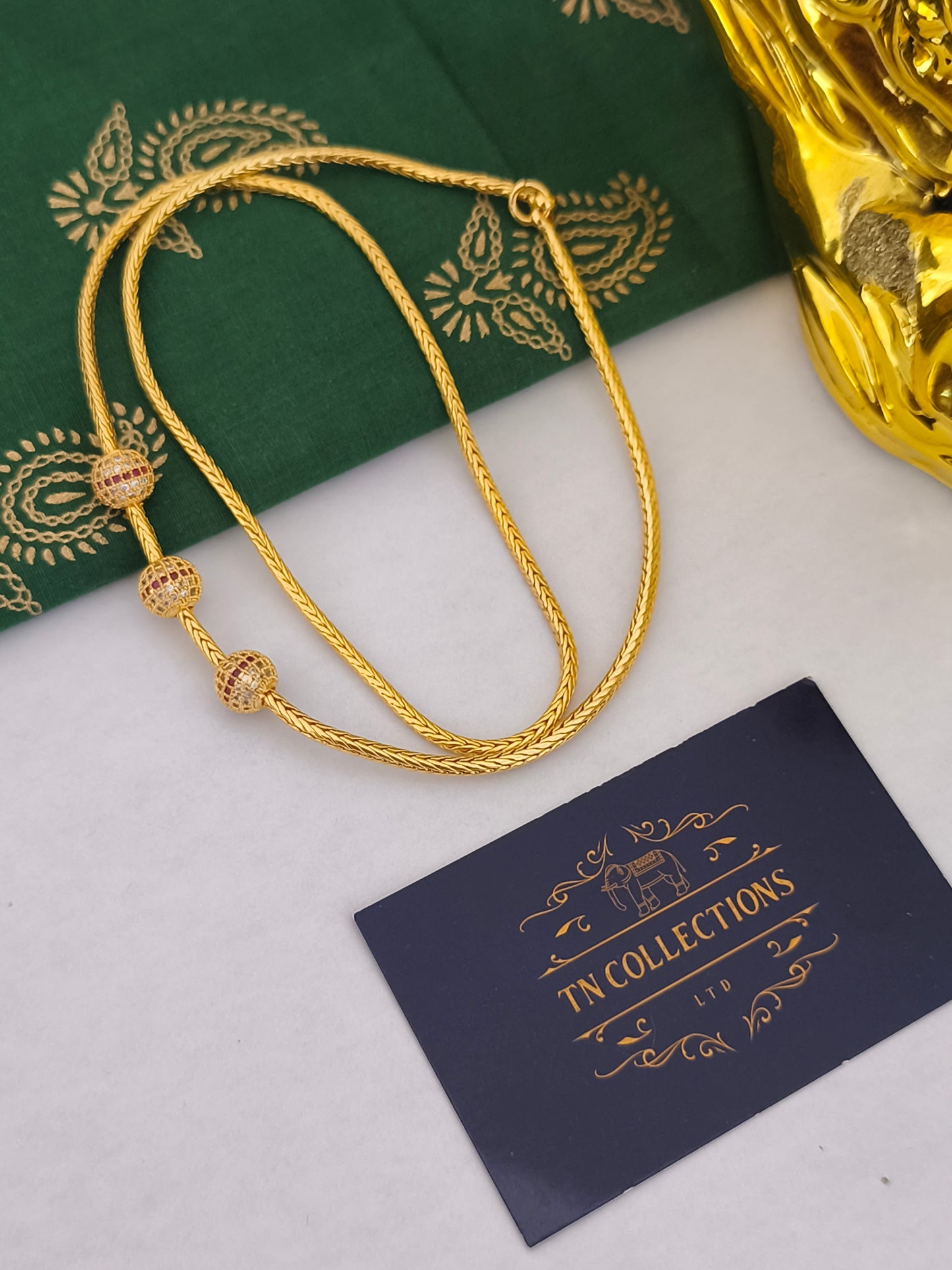 Micro gold mugappu Kodi