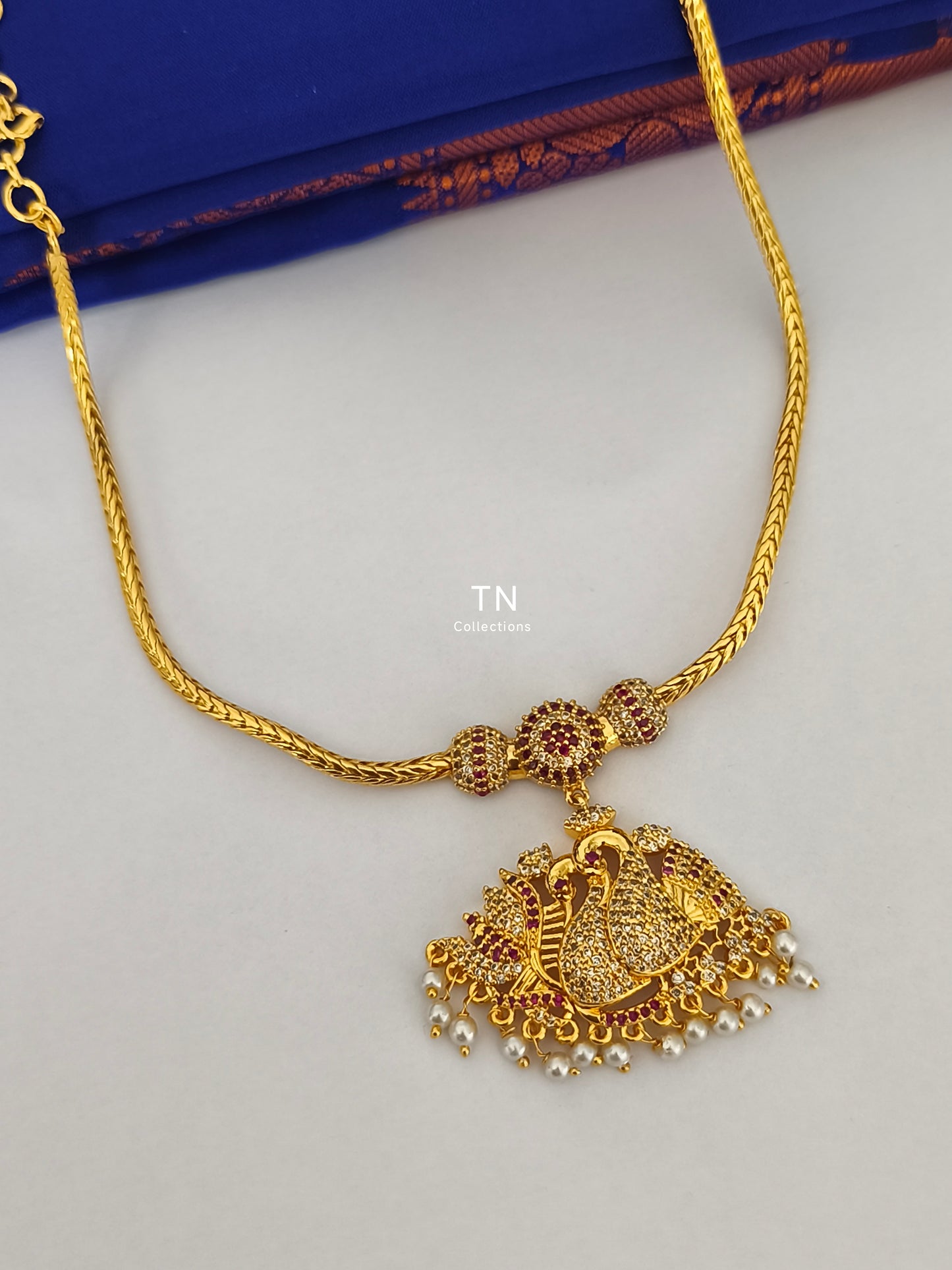 Micro gold plated peacock design Attiyal
