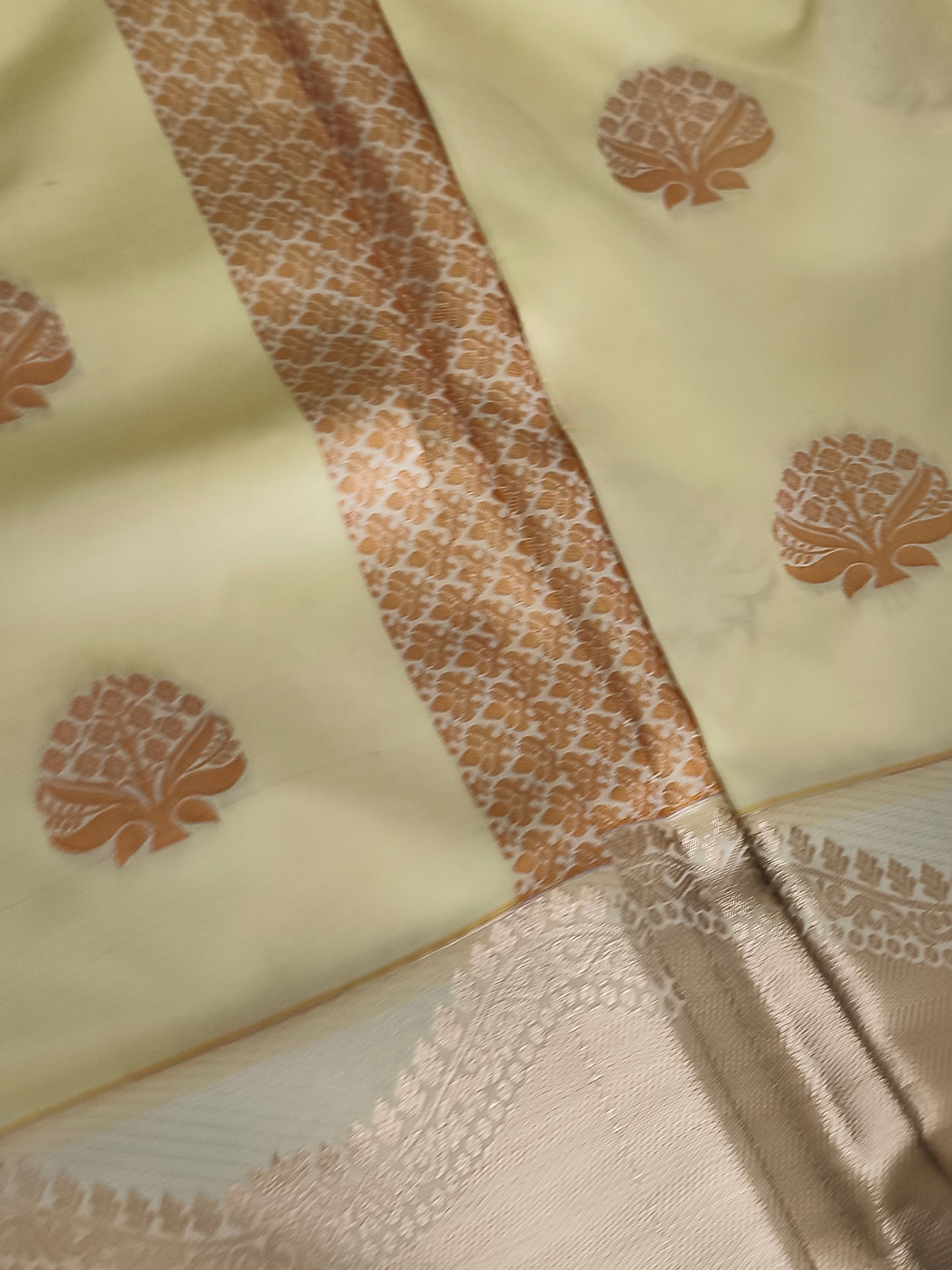 Yellow Kanchi embossed soft silk saree