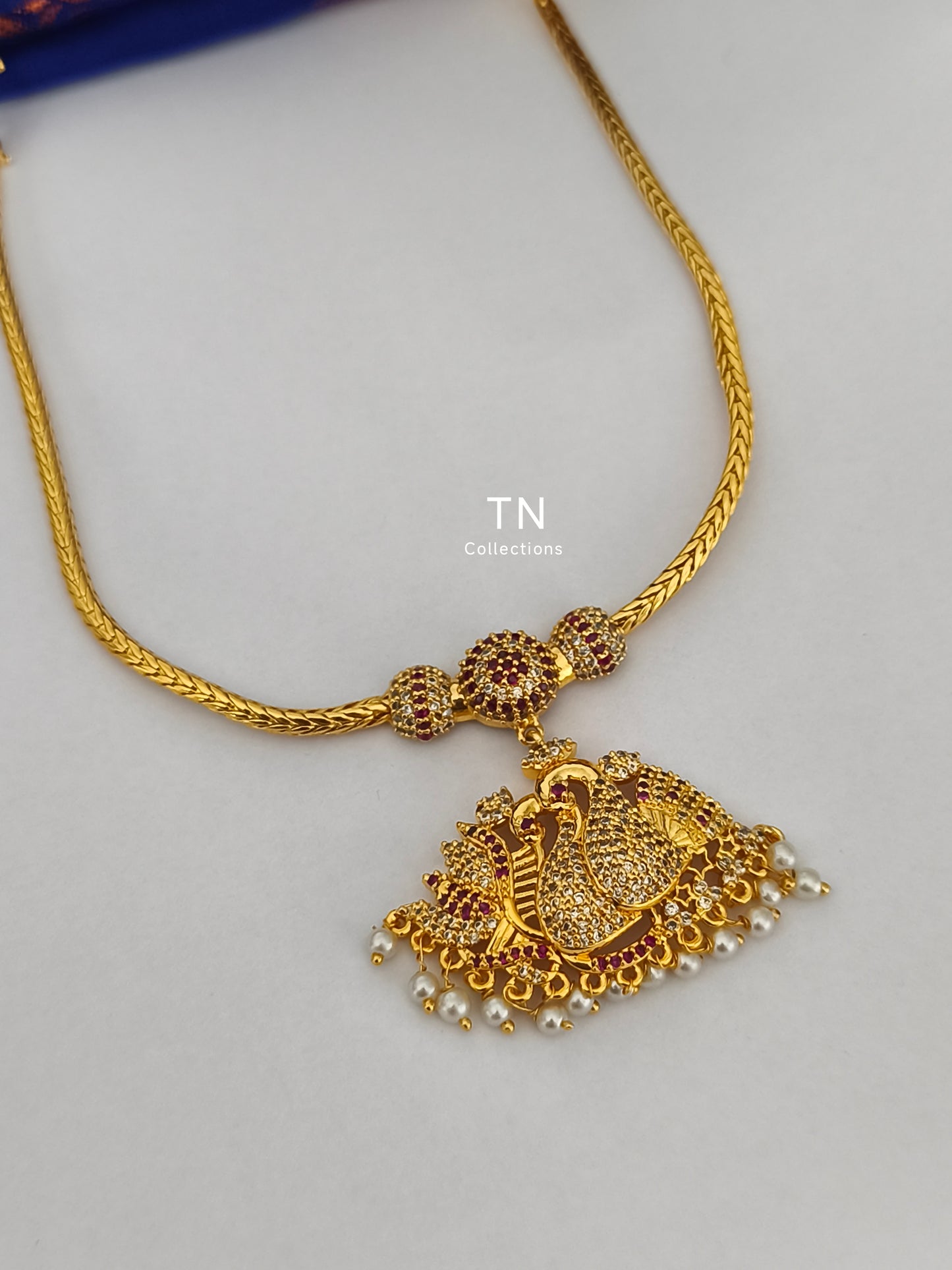 Micro gold plated peacock design Attiyal