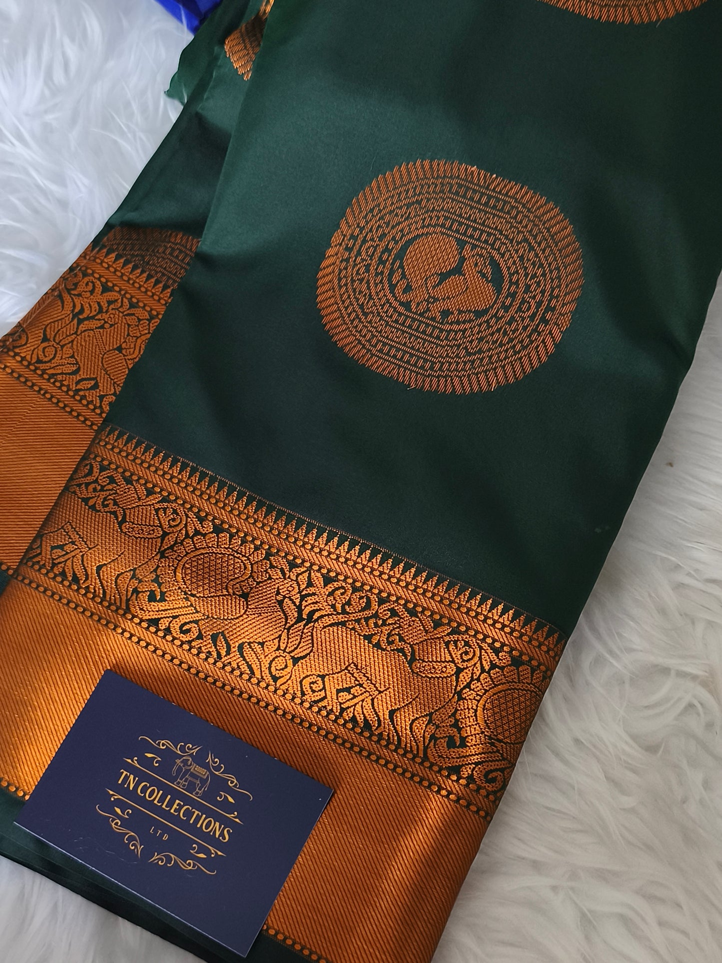 Dark Green Traditional Kanchi embossed Soft Silk saree