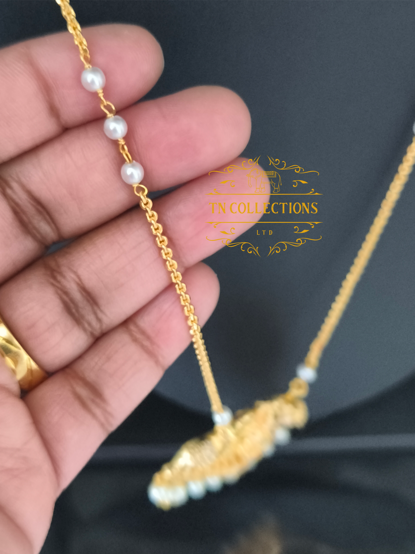 Micro Gold-Plated Lakshmi Pathakkam with single layer pearl chain (Ruby & White stones)