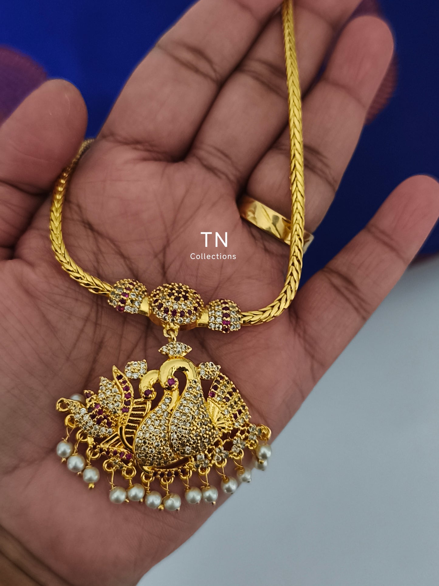 Micro gold plated peacock design Attiyal