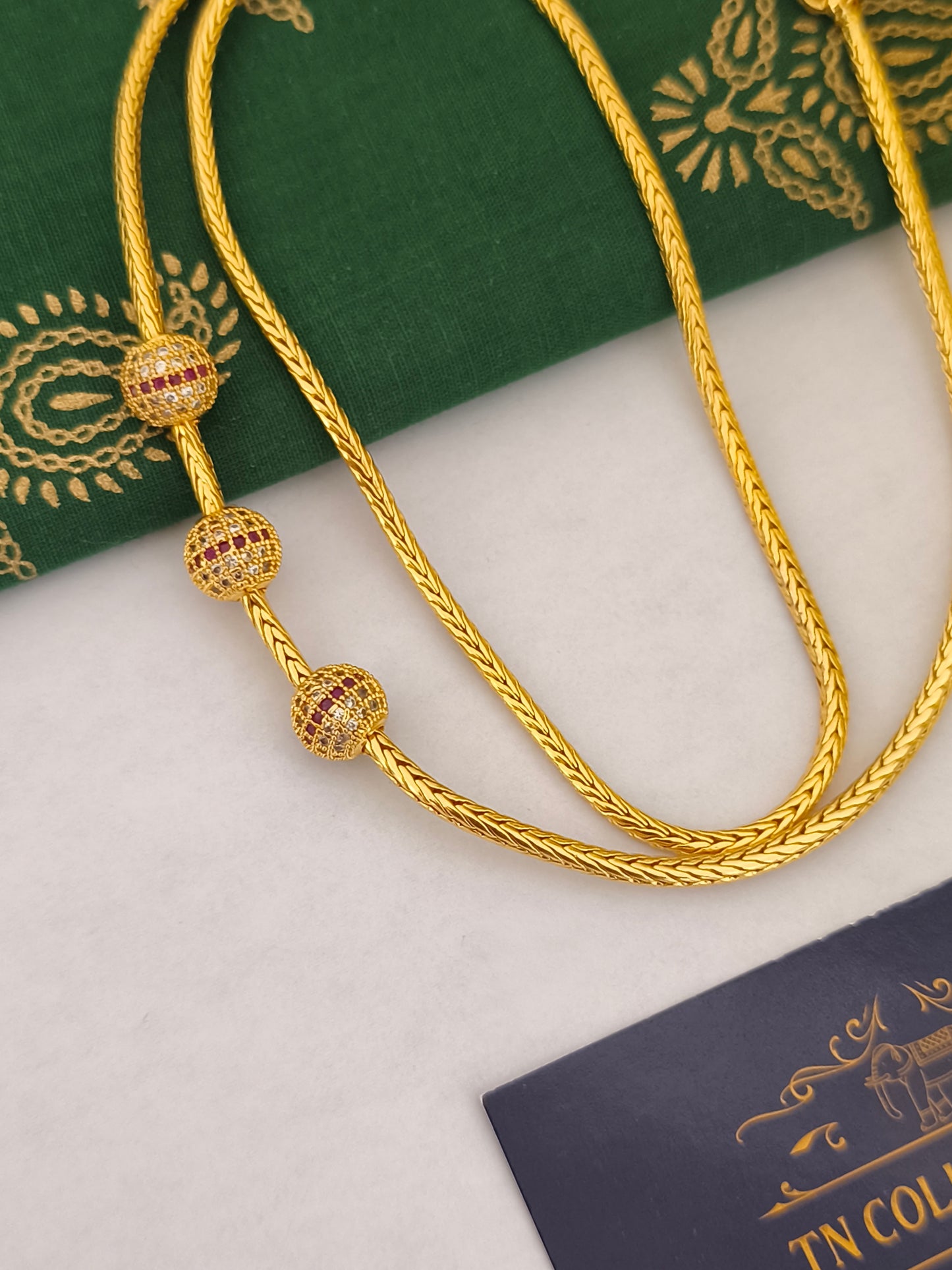 Micro gold mugappu Kodi