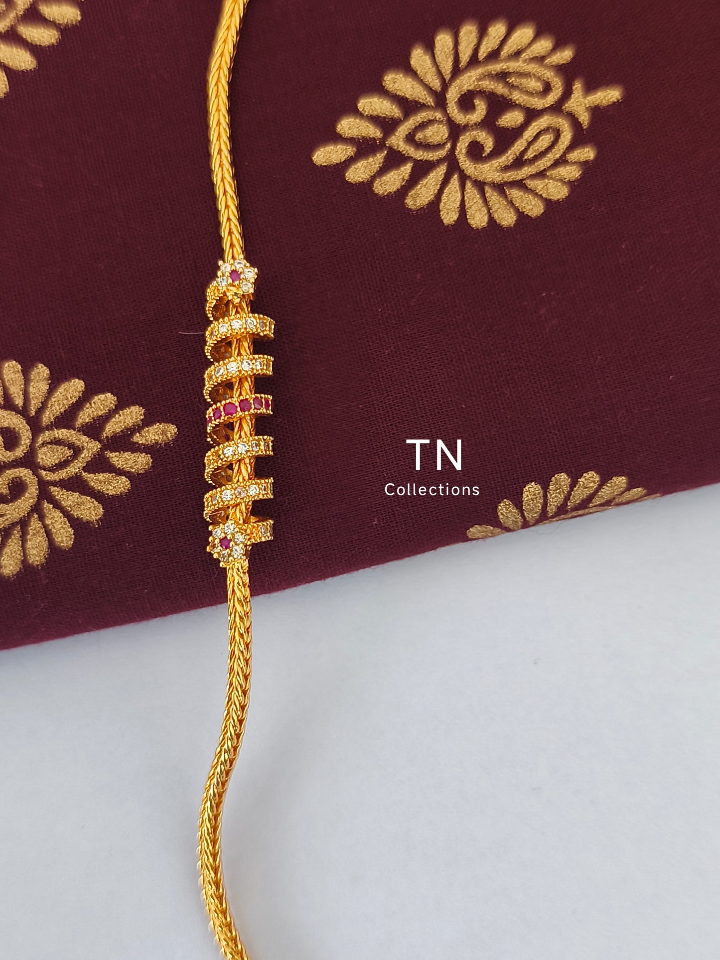 Micro gold plated Traditional Mugappu Kodi (White & Ruby stone)