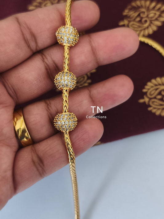 Gold plated Traditional Mugappu Kodi (white stone)