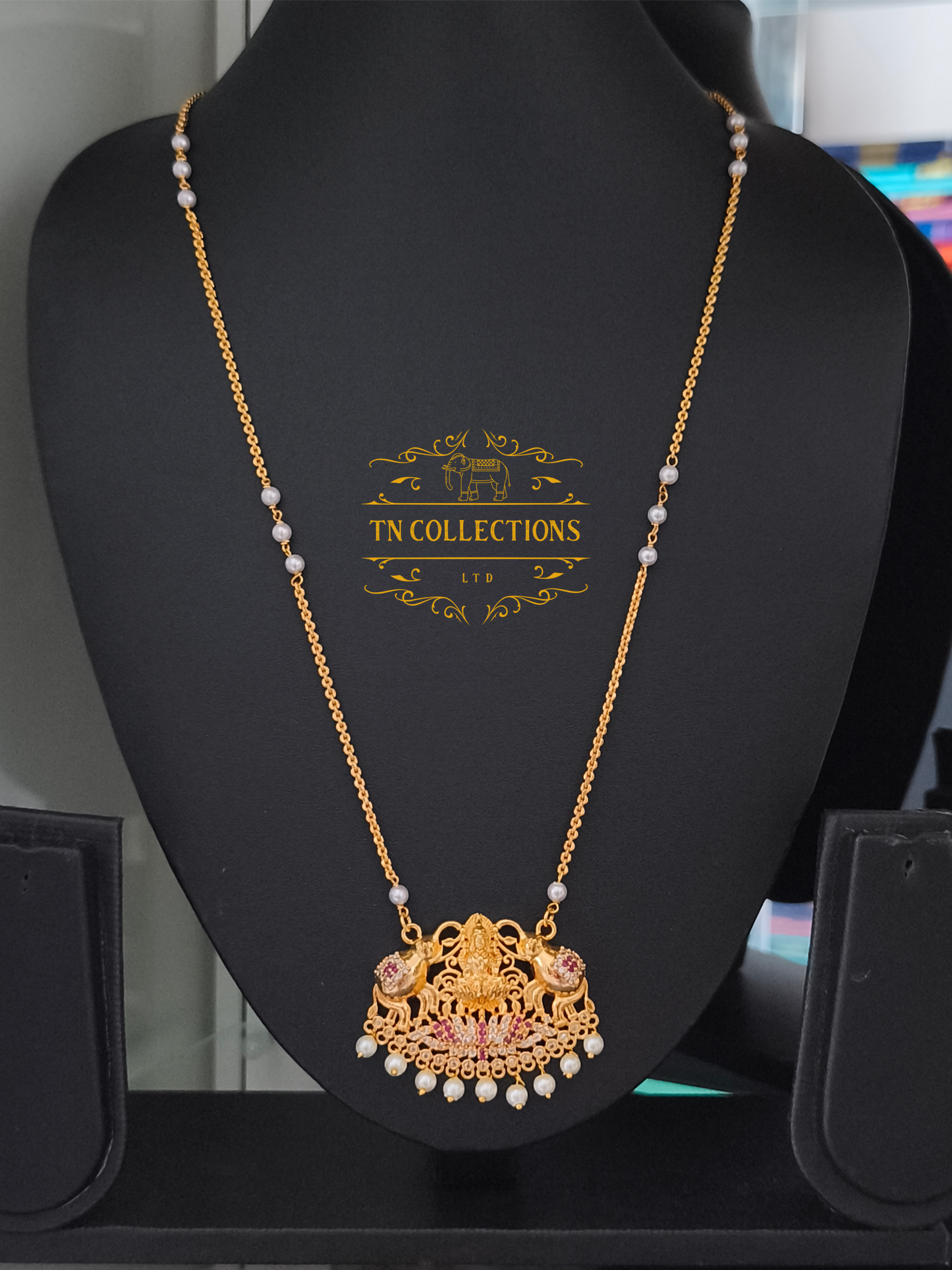 Micro Gold-Plated Lakshmi Pathakkam with single layer pearl chain (Ruby & White stones)