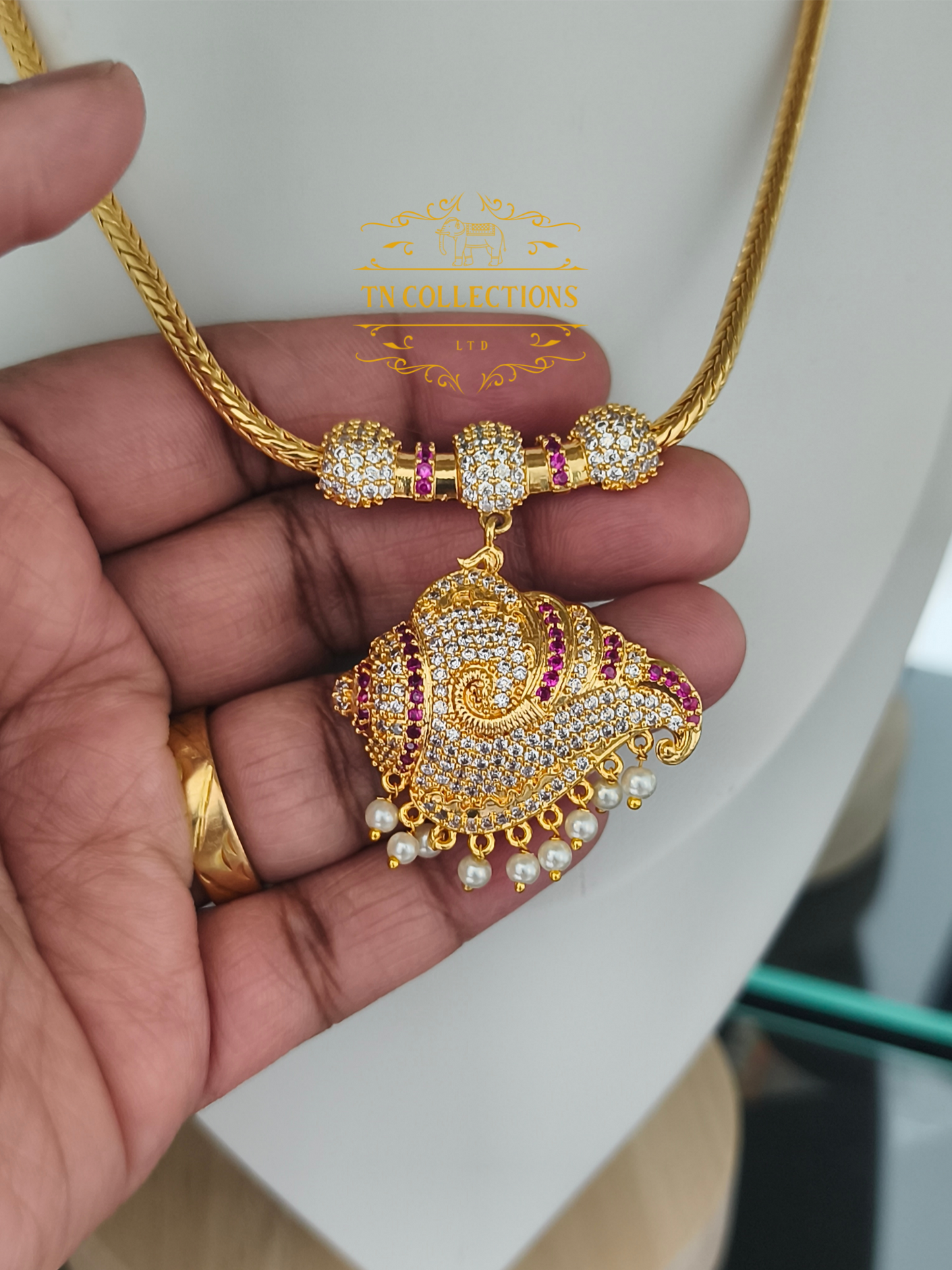 Micro Gold-Plated Traditional Sangu Attiyal (Ruby & white stones)