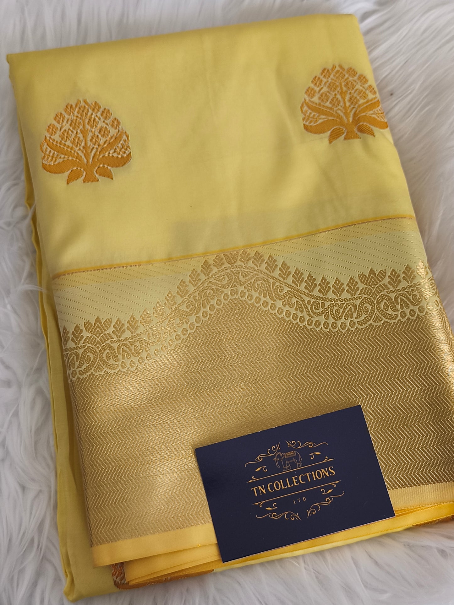 Yellow Kanchi embossed soft silk saree